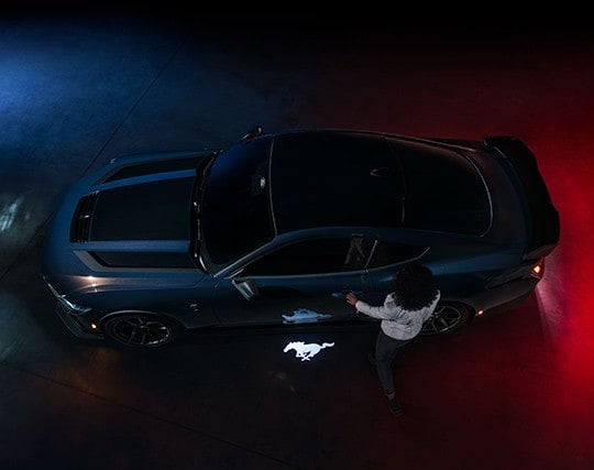 2024 Ford Mustang® Dark Horse™ model with a driver approaching the vehicle | Imperial Country Ford, Inc. in Imperial NE