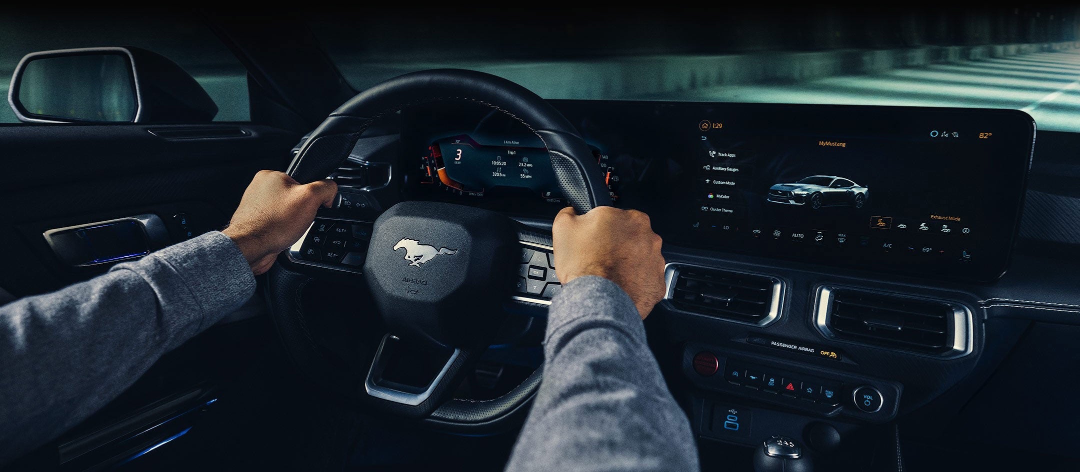 A 2024 Ford Mustang® model interior with a person driving | Imperial Country Ford, Inc. in Imperial NE